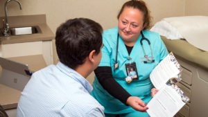 nurse showing patient a brochure