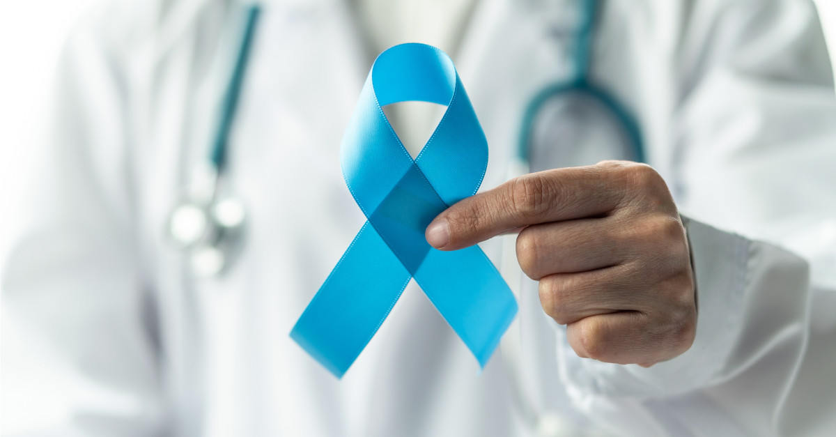 Doctor holding cancer awareness ribbon