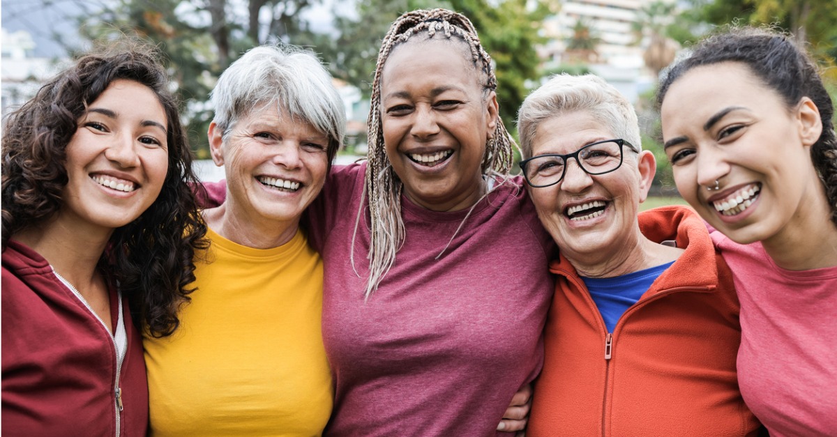 5 women smiling in a group