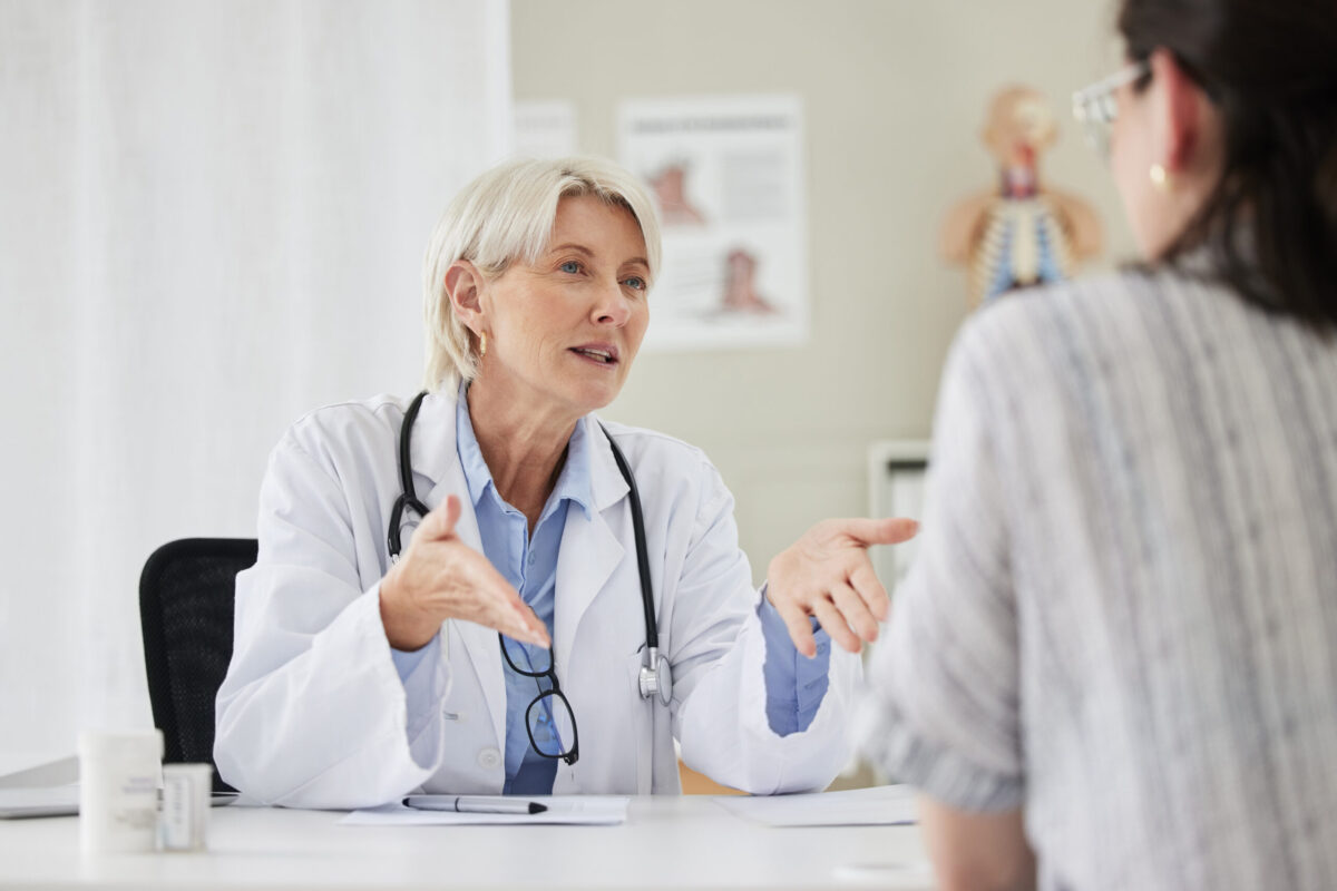 Physician speaking with patient