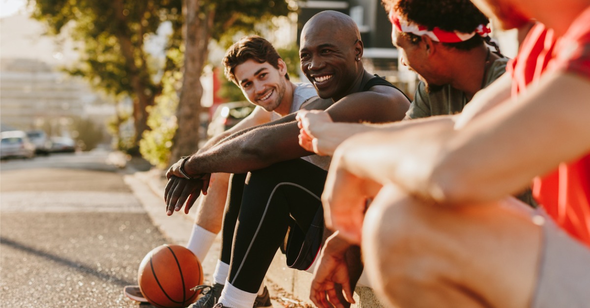 Active men sitting outside