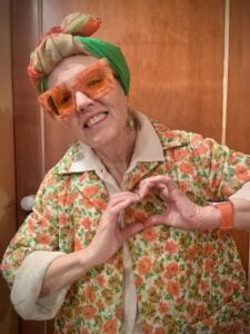 Karen Strelecki of Madison poses with her hands in a heart shape