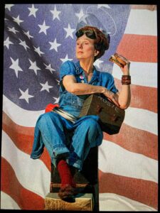 Karen Strelecki posing as Rosie the Riveter